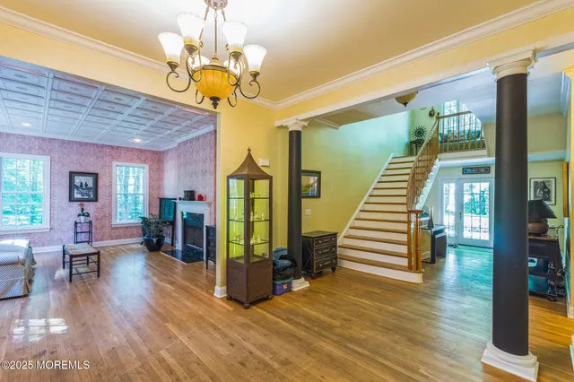 a view of a livingroom with furniture and stairs