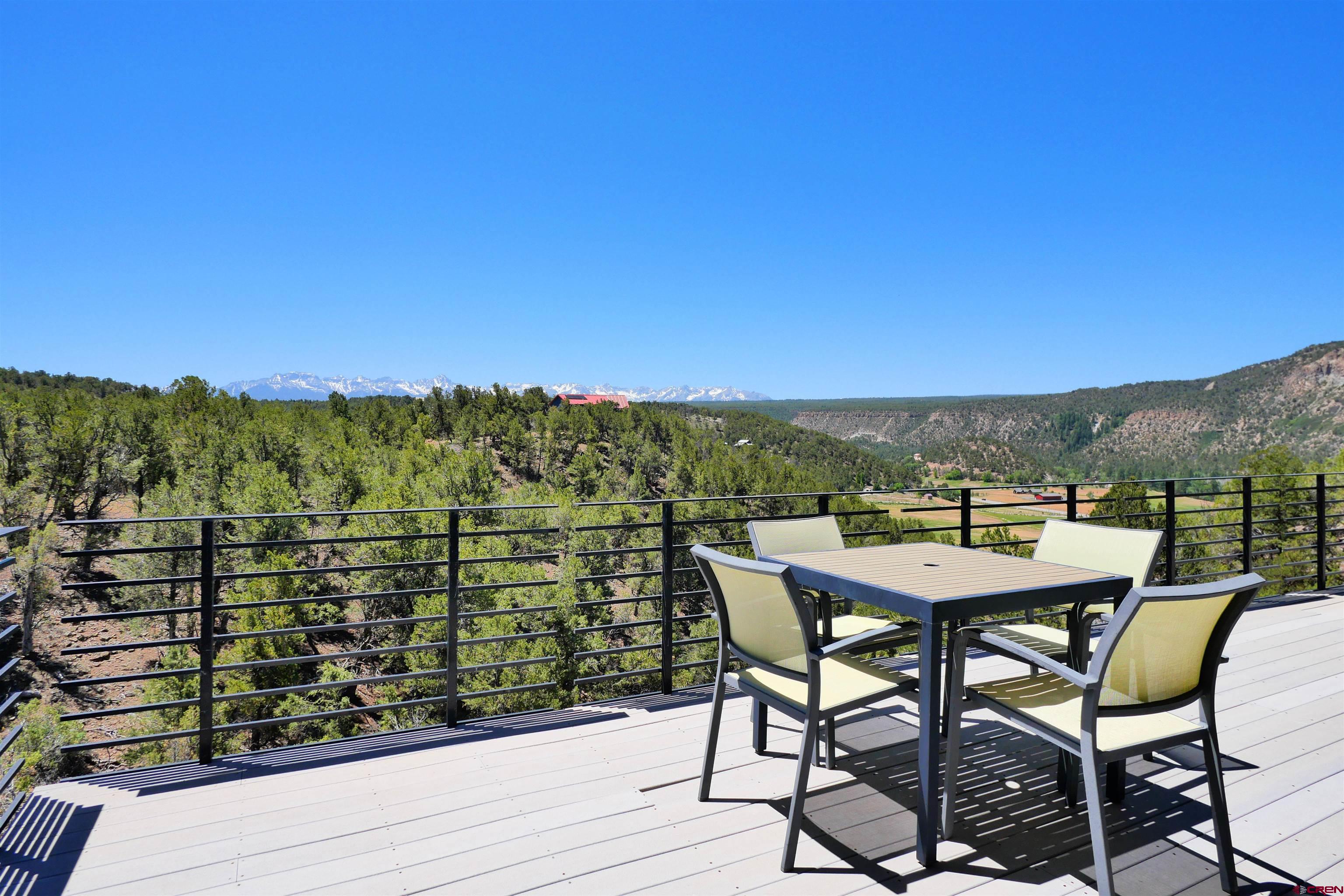 456 Ridge Road Montrose, CO 81403 - Photo 16 of 24 a view of a chairs and table on the terrace