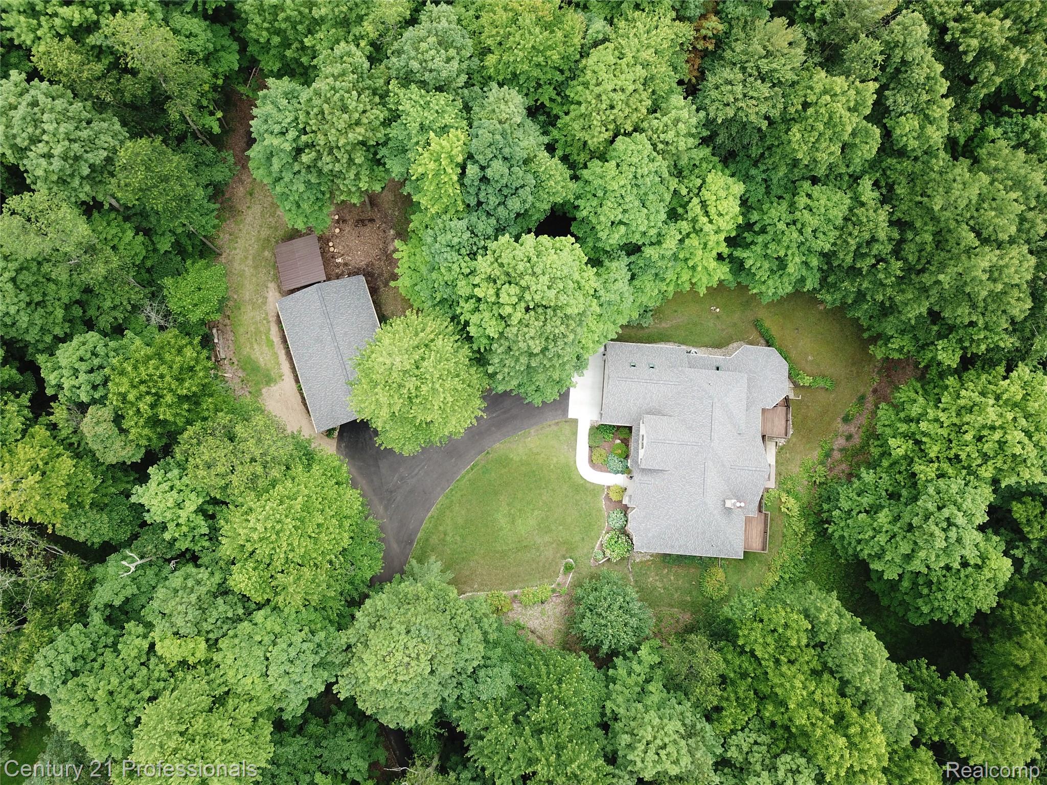9867 Rainbow Ridge Drive Schoolcraft, MI 49087 - Photo 11 of 82 Aerial perspective showcasing a secluded residence surrounded by mature trees
