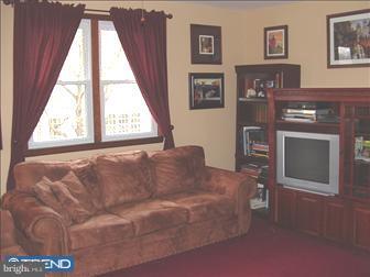 4435 Church Road Mount Laurel, NJ 08054 - Photo 3 of 6 a living room with furniture and a fireplace