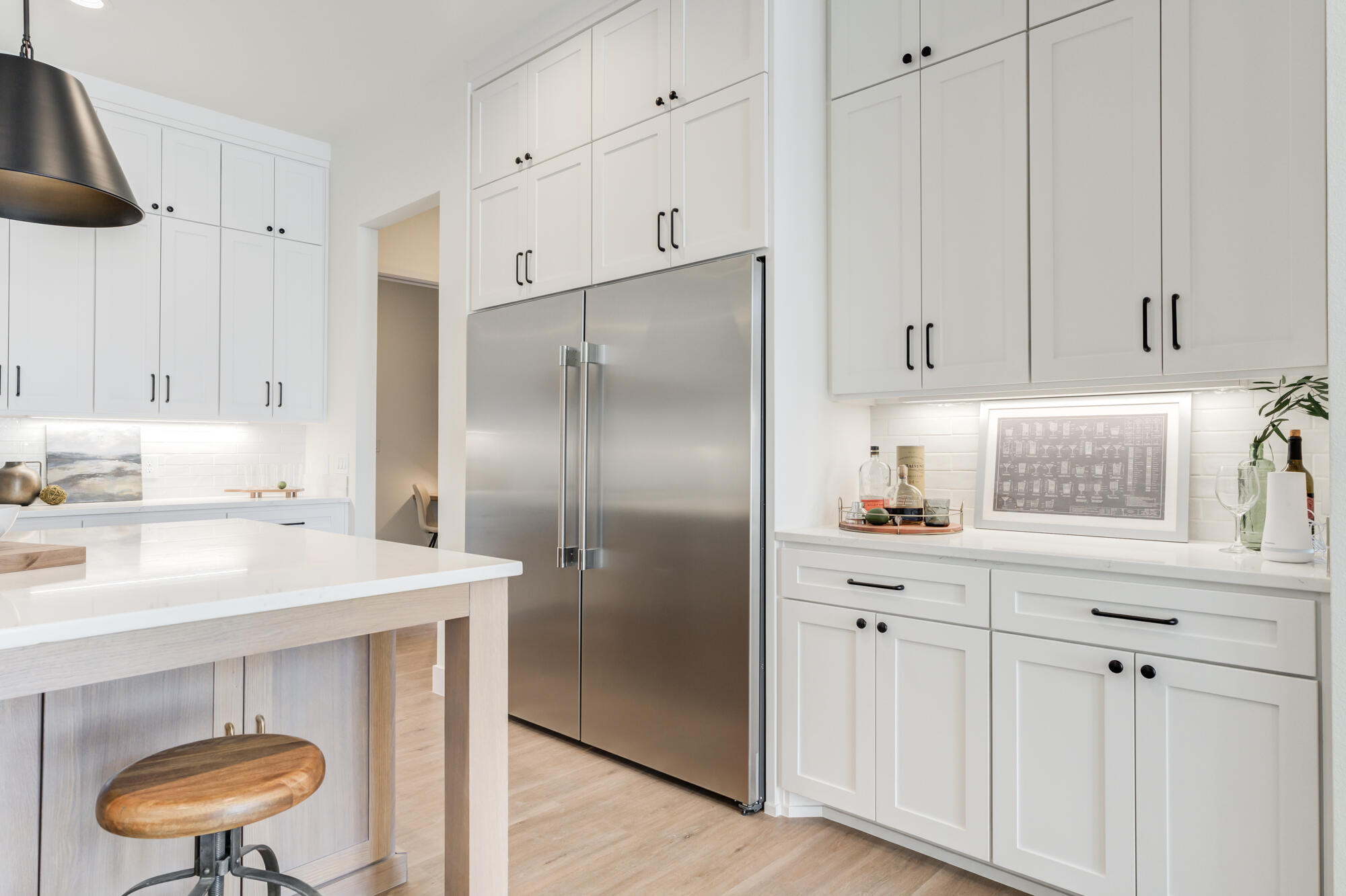 3608 144th Street Lubbock, TX 79423 - Photo 12 of 51 a kitchen with kitchen island a counter top space a sink stainless steel appliances and cabinets