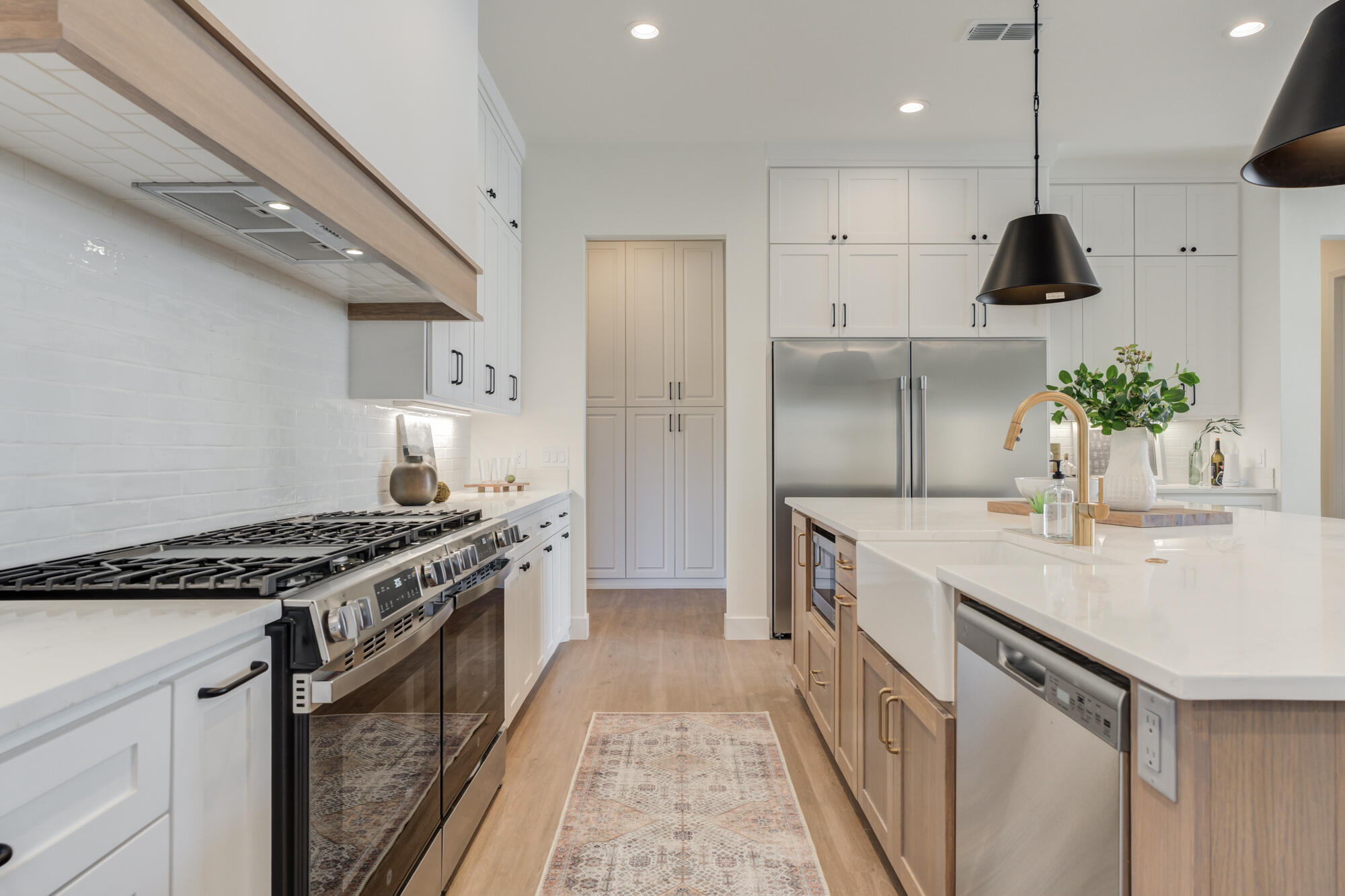 3608 144th Street Lubbock, TX 79423 - Photo 17 of 51 a kitchen with stainless steel appliances granite countertop a sink stove and refrigerator