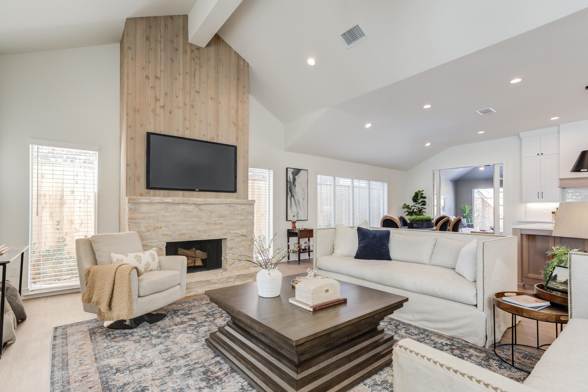 3608 144th Street Lubbock, TX 79423 - Photo 2 of 51 a living room with fireplace furniture and a flat screen tv