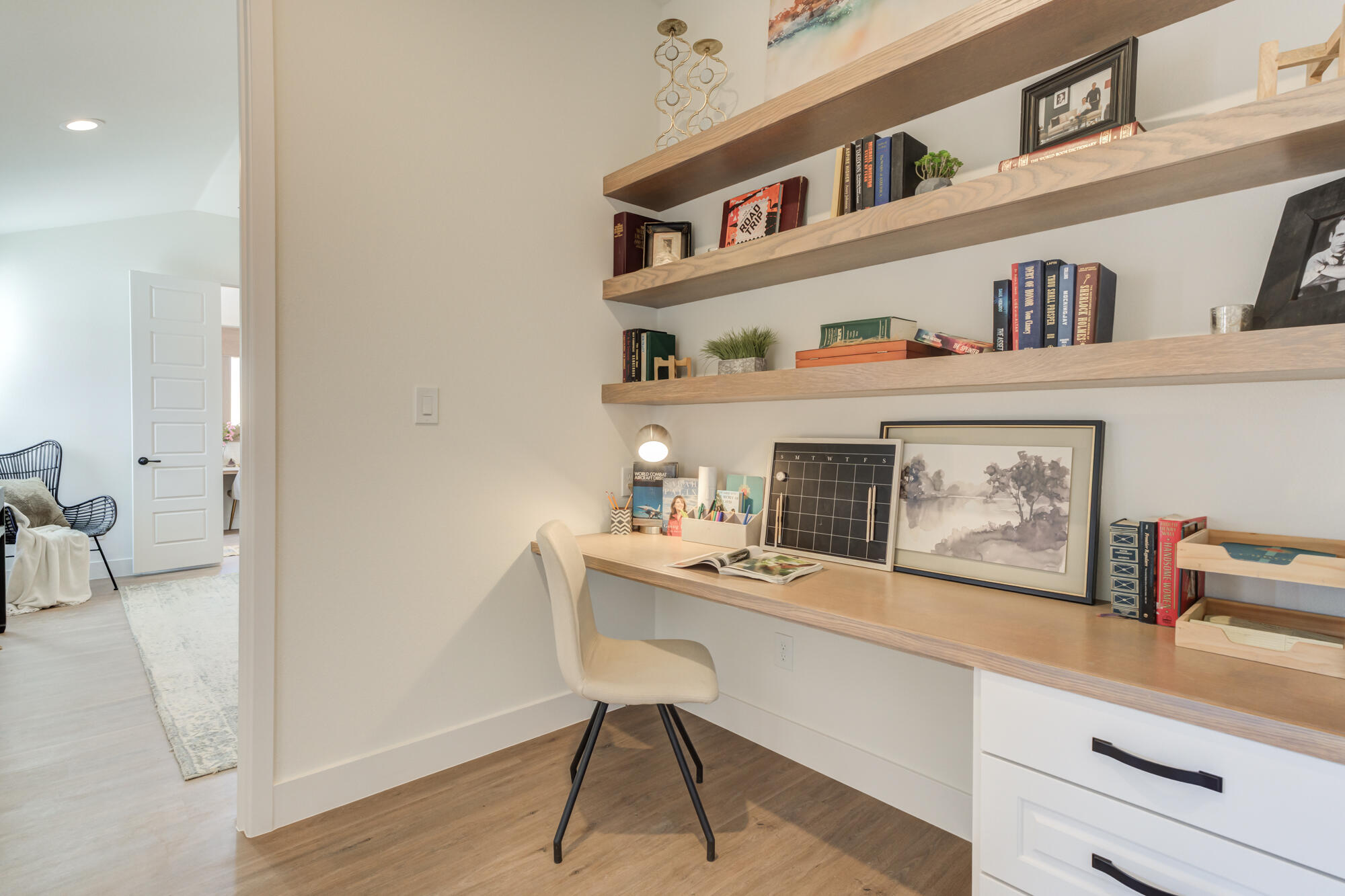 3608 144th Street Lubbock, TX 79423 - Photo 23 of 51 a room with furniture a rug and a book shelf