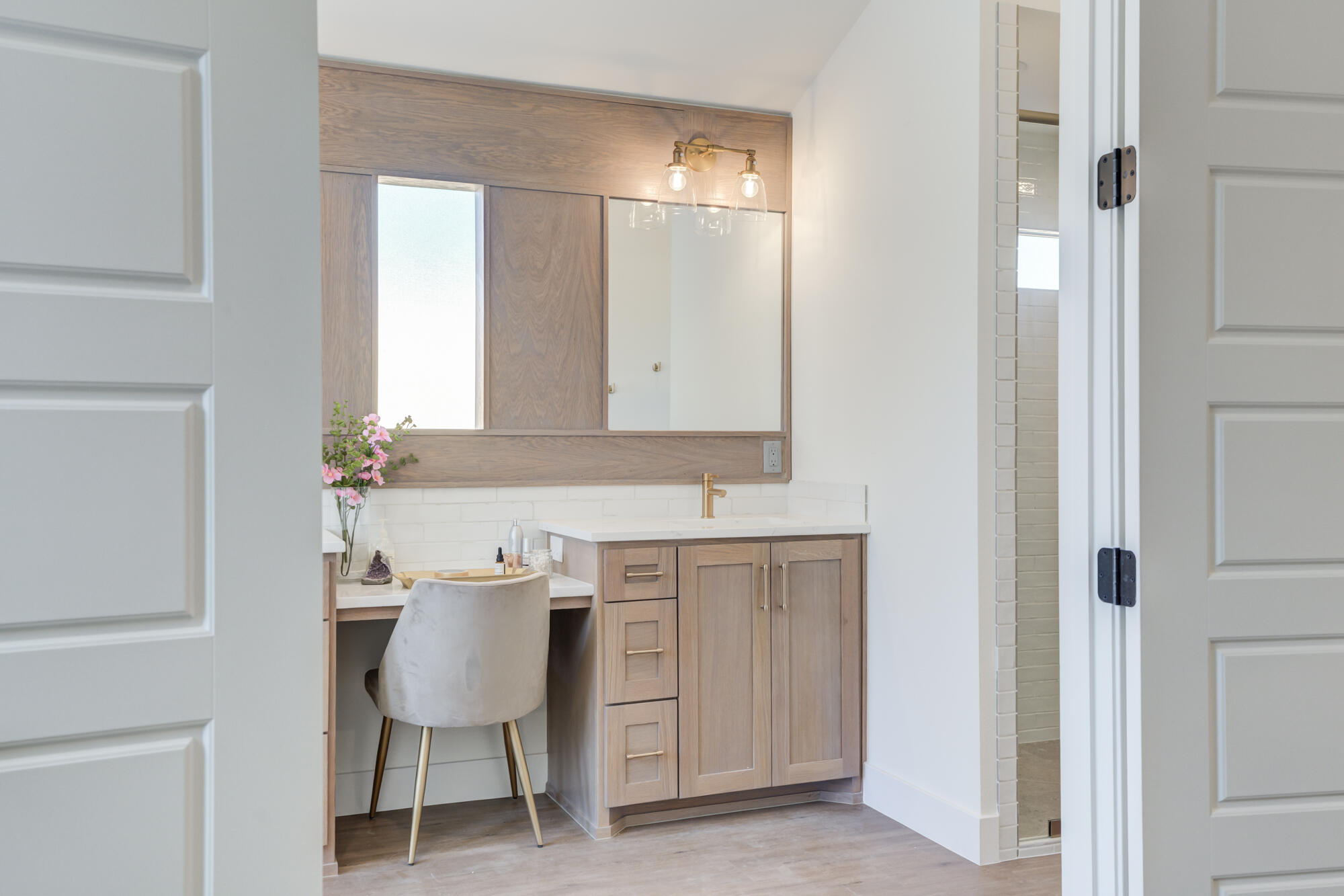 3608 144th Street Lubbock, TX 79423 - Photo 26 of 51 a bathroom with a sink and a mirror