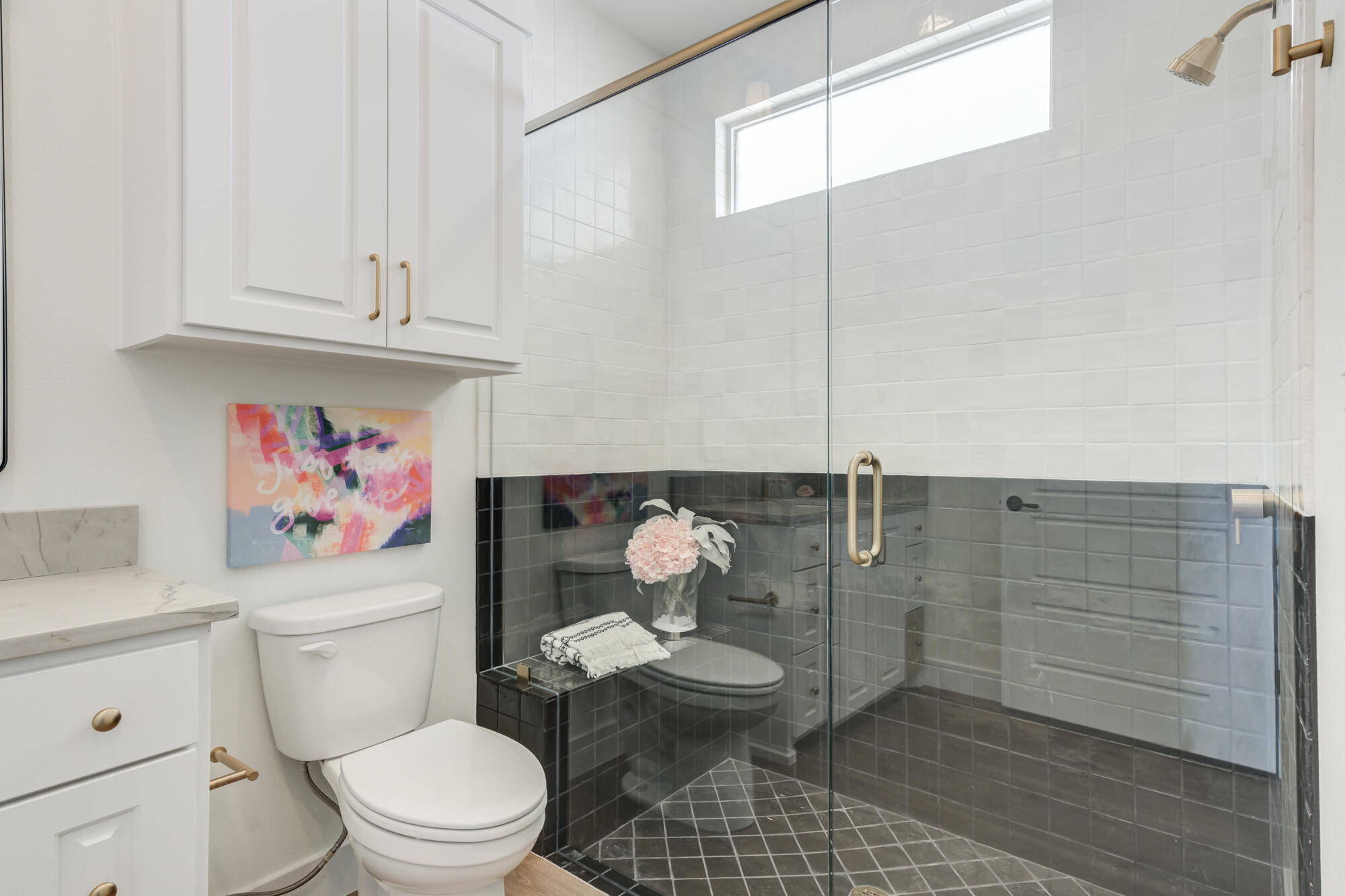 3608 144th Street Lubbock, TX 79423 - Photo 35 of 51 a bathroom with a sink a toilet and shower