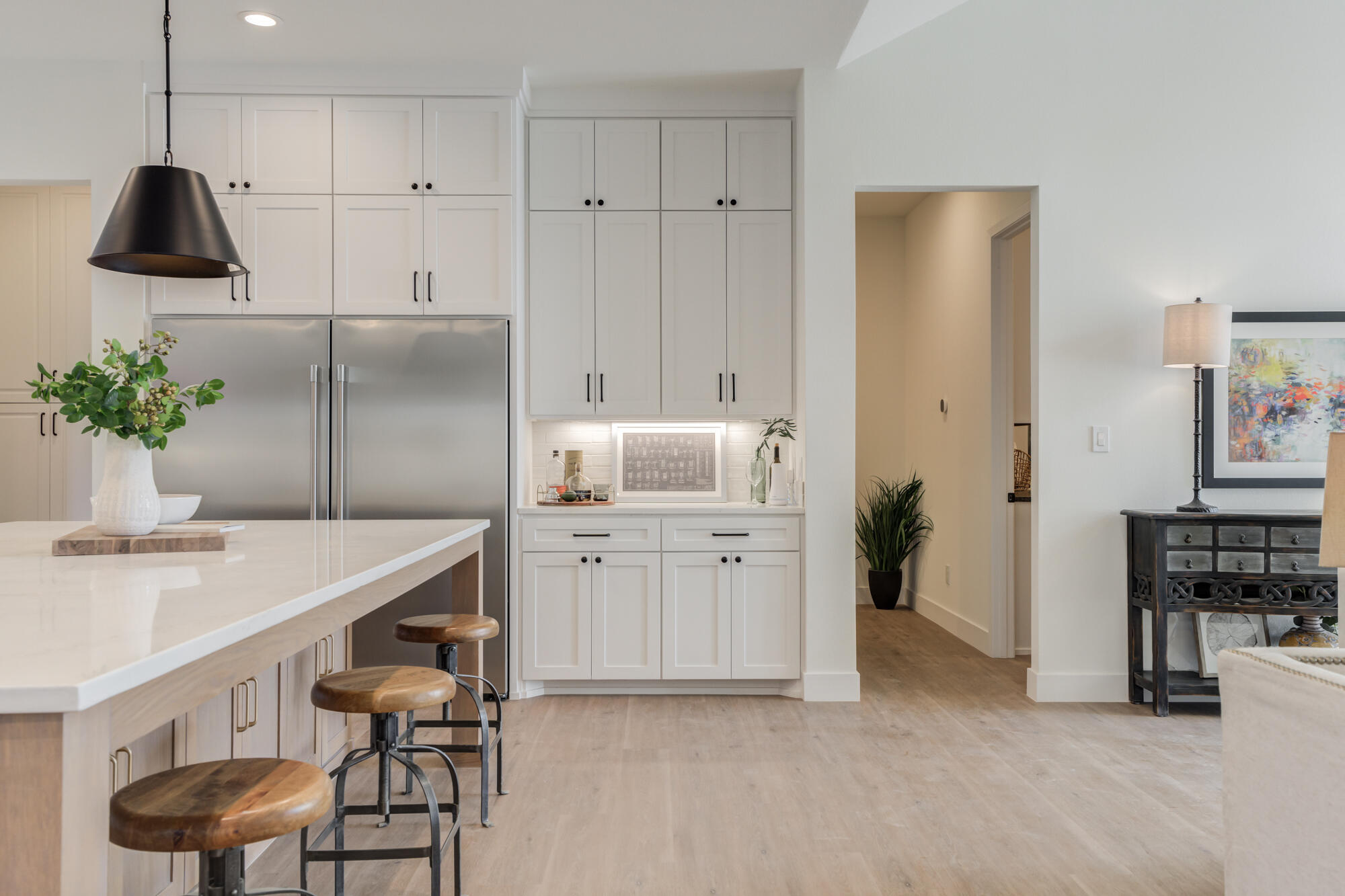 3608 144th Street Lubbock, TX 79423 - Photo 40 of 51 a kitchen that has a sink a table and chairs in it