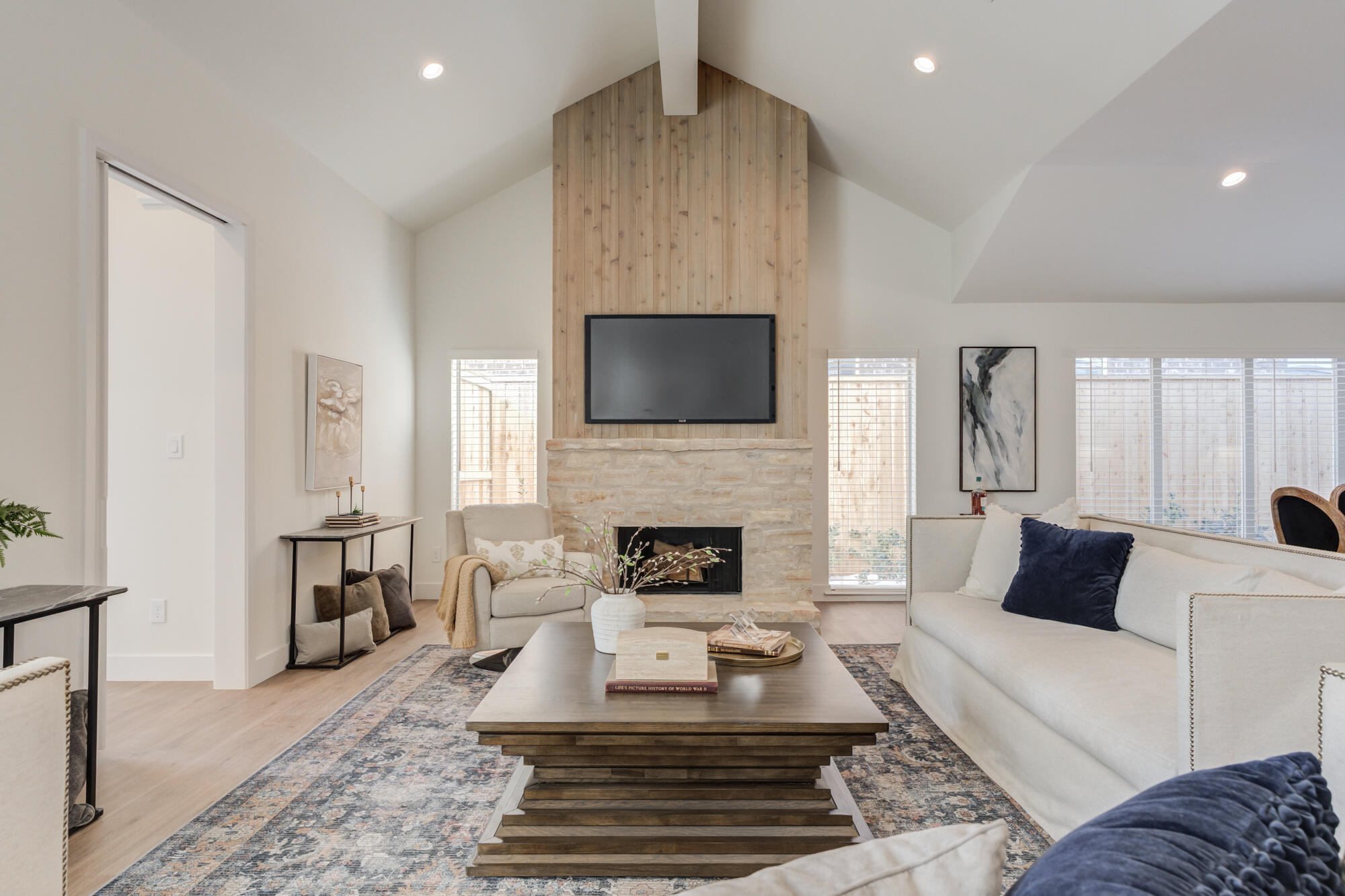 3608 144th Street Lubbock, TX 79423 - Photo 4 of 51 a living room with furniture a fireplace and a flat screen tv