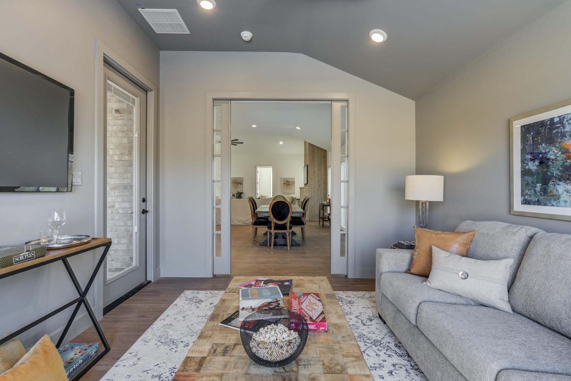 3608 144th Street Lubbock, TX 79423 - Photo 45 of 51 a living room with furniture and a flat screen tv