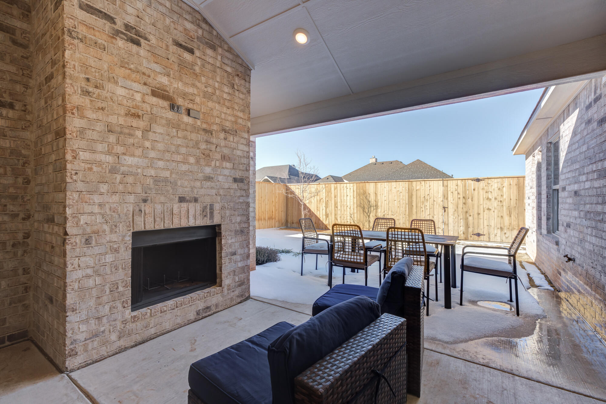 3608 144th Street Lubbock, TX 79423 - Photo 49 of 51 a living room with furniture a fireplace and city view
