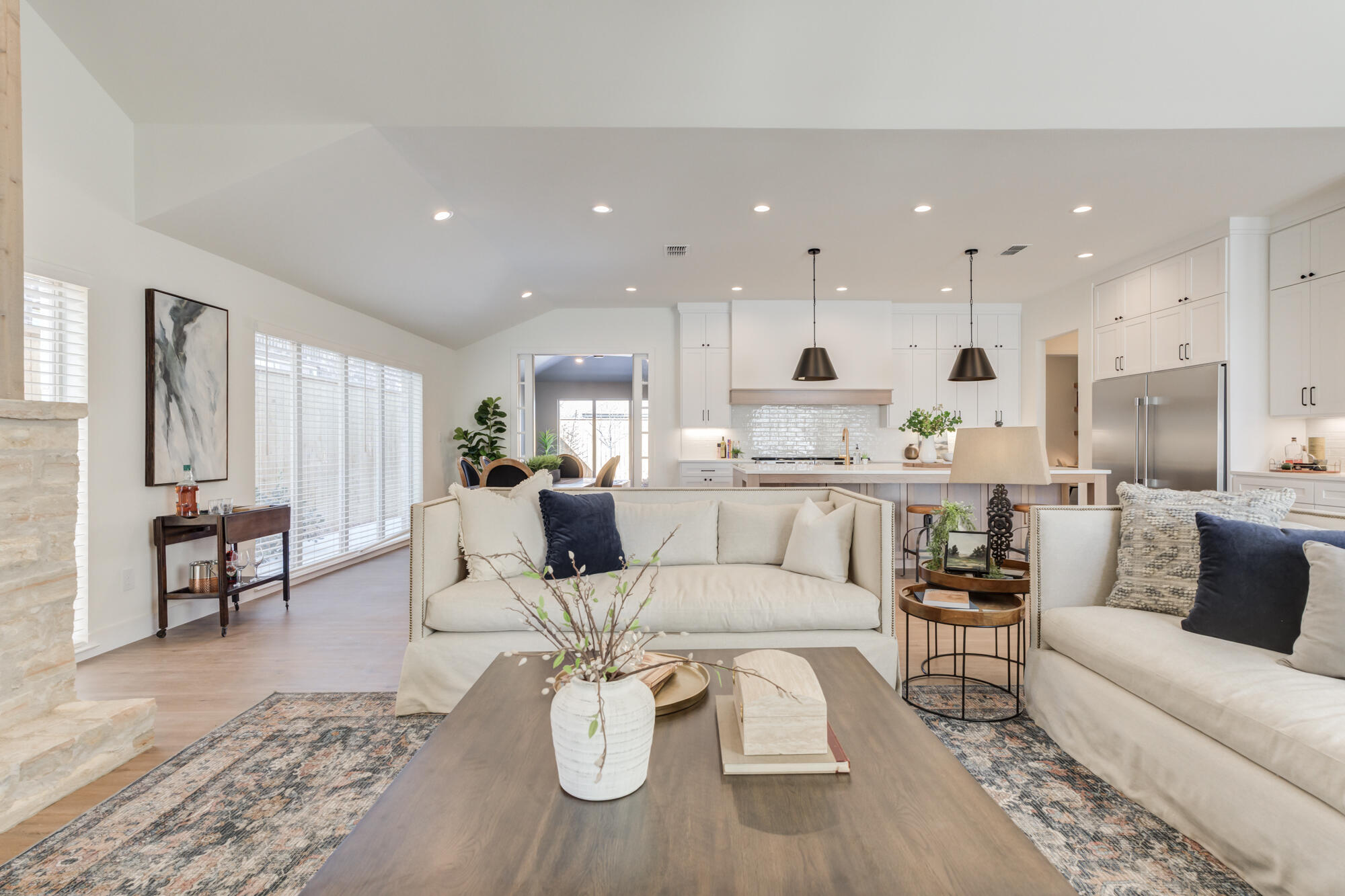 3608 144th Street Lubbock, TX 79423 - Photo 7 of 51 a living room with furniture kitchen view and a wooden floor