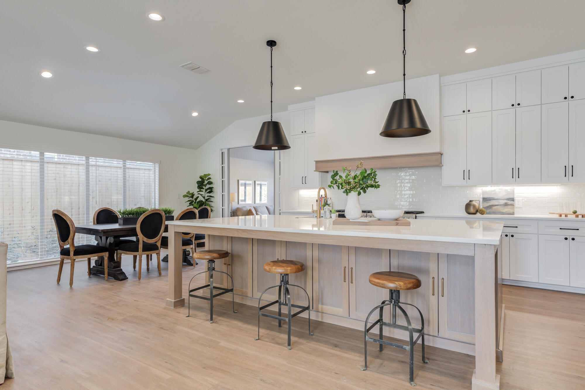 3608 144th Street Lubbock, TX 79423 - Photo 10 of 51 a kitchen with kitchen island stainless steel appliances a table and chairs