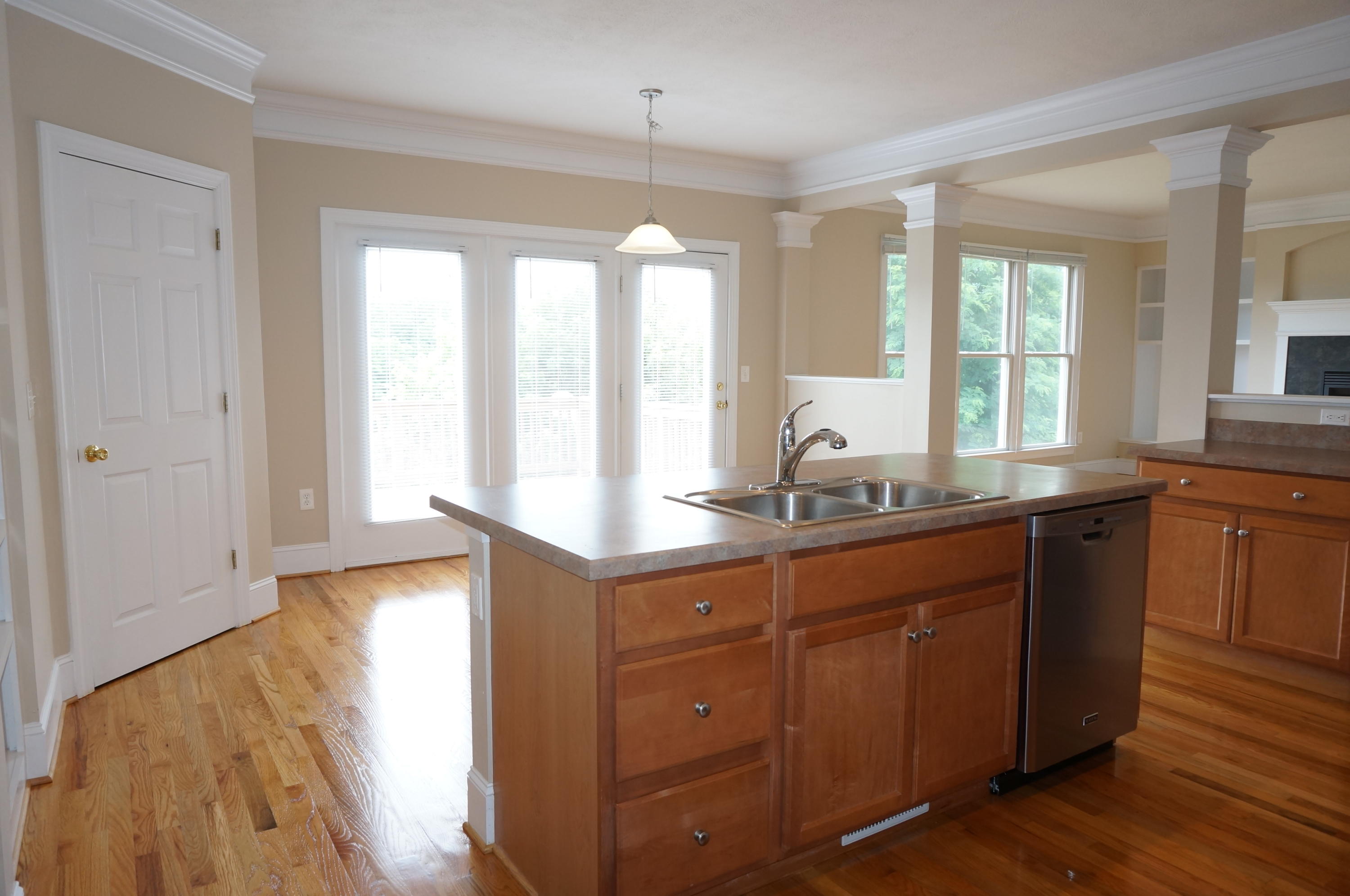 5734 North Fork Road Elliston, VA 24087 - Photo 4 of 27 a kitchen with granite countertop a sink and dishwasher with wooden floor