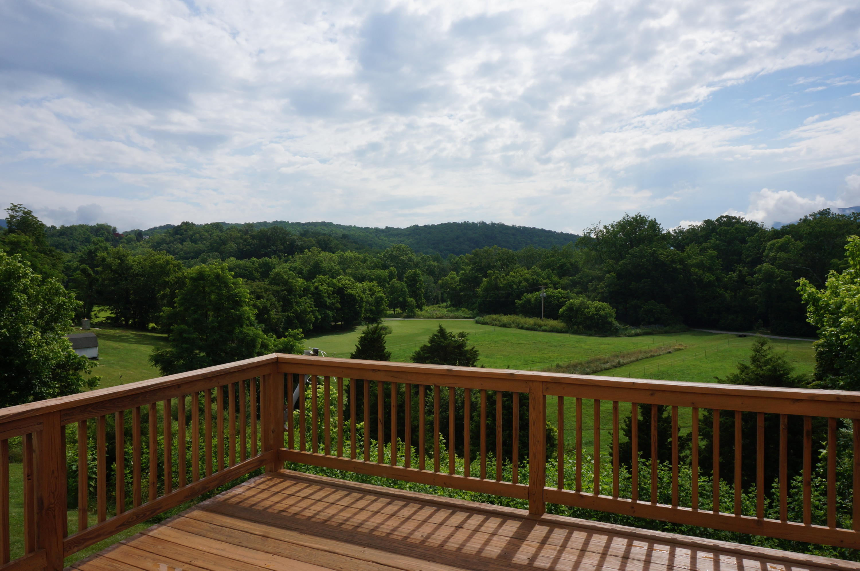 5734 North Fork Road Elliston, VA 24087 - Photo 9 of 27 a view of balcony with wooden floor and fence