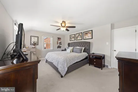 a bedroom with a bed and a sink