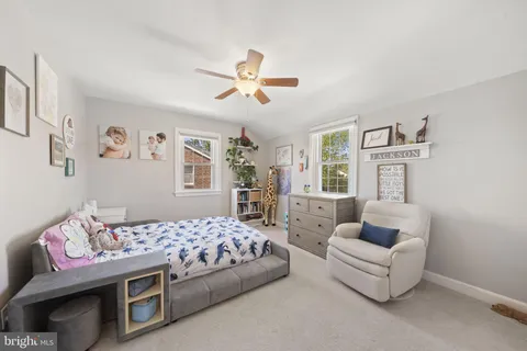 a bedroom with furniture and a chandelier