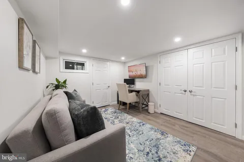 a living room with furniture and a rug