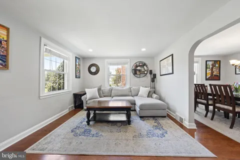 a living room with furniture and a table