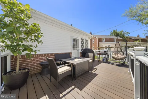 a view of a patio with wooden floor