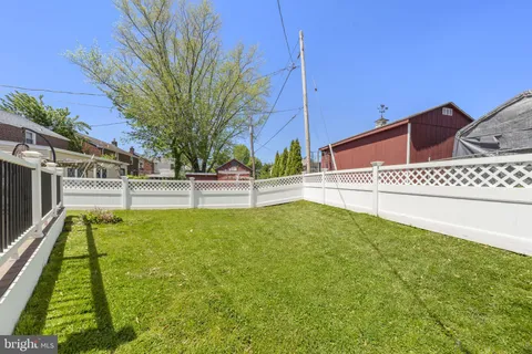 a view of swimming pool with a yard