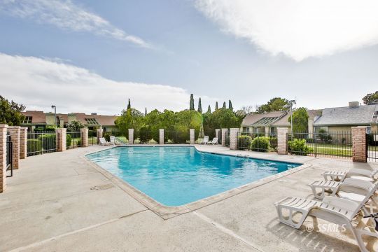 1023 North Norma Street Ridgecrest, CA 93555 - Photo 32 of 32 a view of a swimming pool with a lounge chairs