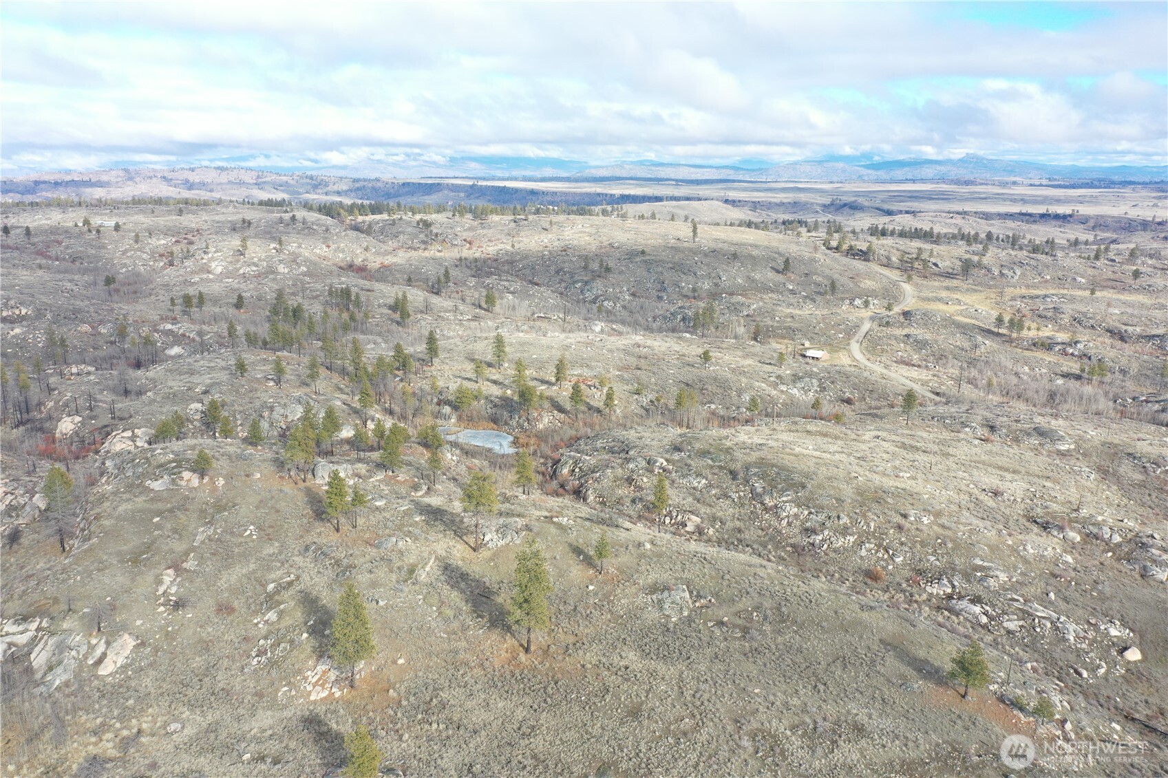 372 C Cameron Lake Loop Road Okanogan, WA 98840 - Photo 19 of 20 a view of a yard with an ocean