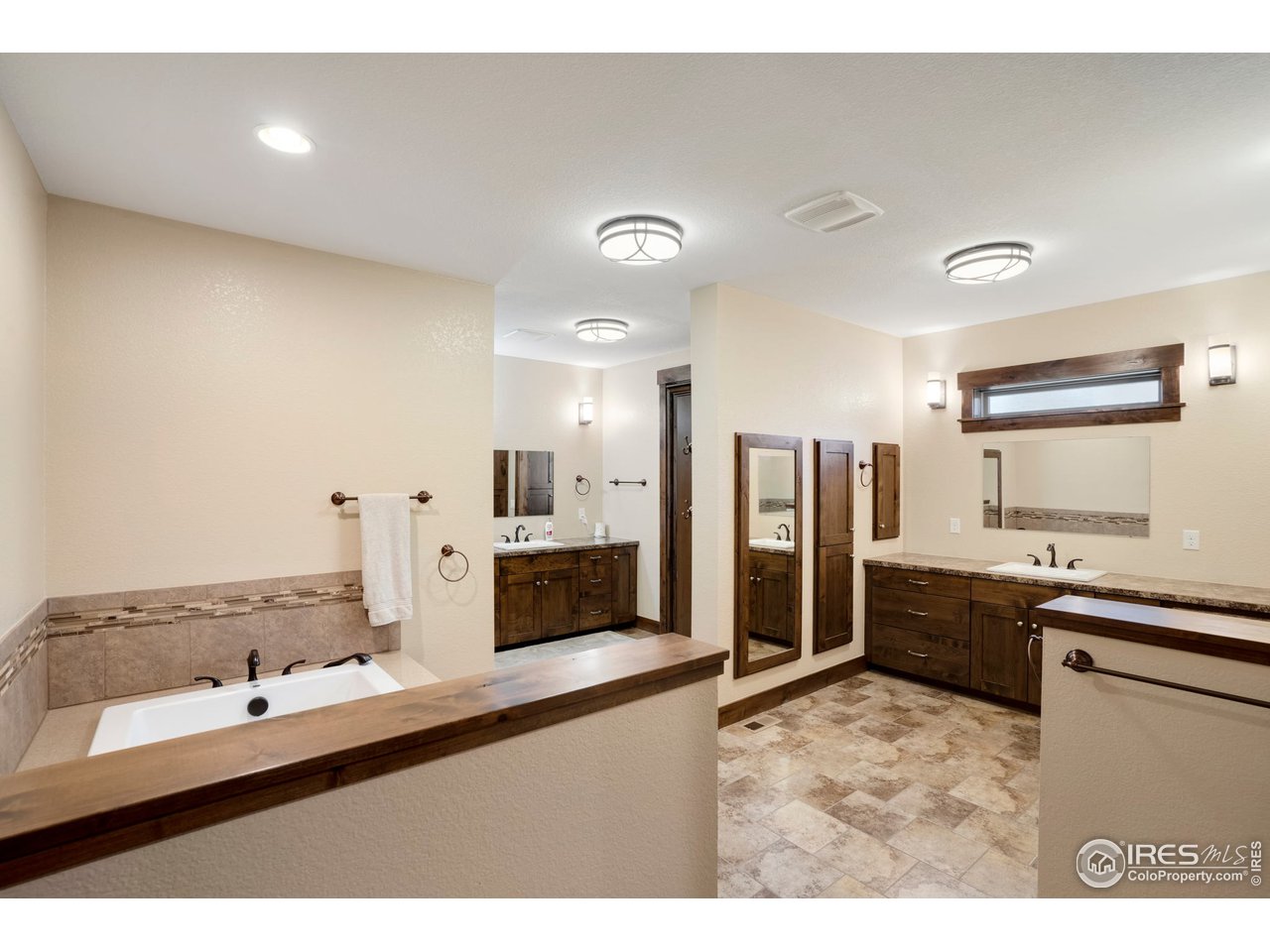 608 Riverside Court Greeley, CO 80634 - Photo 20 of 36 Wow, this primary bath has space for days, over 200sf