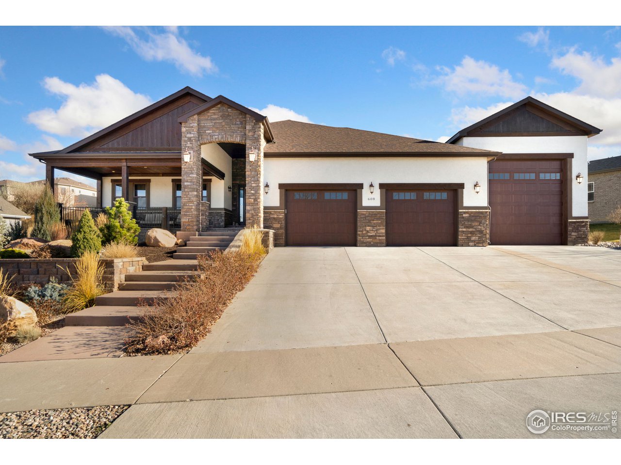 608 Riverside Court Greeley, CO 80634 - Photo 2 of 36 Large driveway is plumbed for heat. Correct, no need to shovel snow here