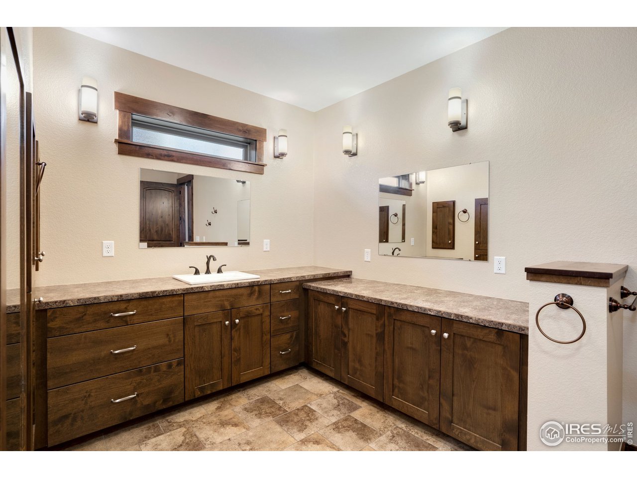 608 Riverside Court Greeley, CO 80634 - Photo 21 of 36 Primary bath has major counter space to spread out