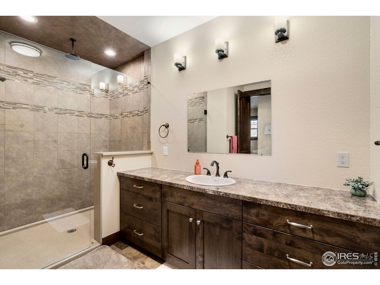608 Riverside Court Greeley, CO 80634 - Photo 25 of 36 Big Second bedroom en suite with overhead and wall shower heads
