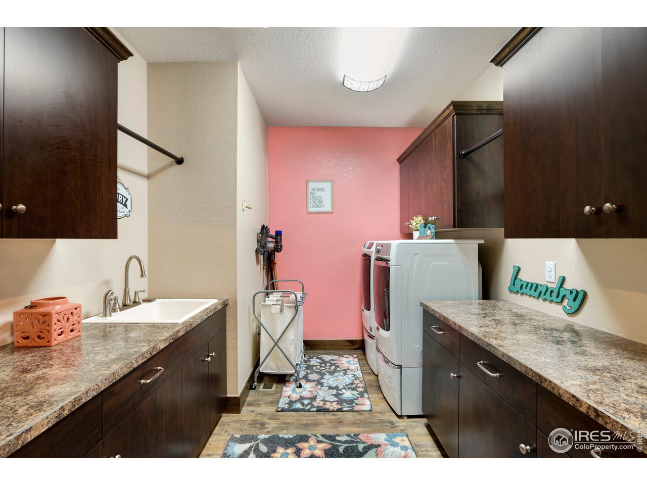 608 Riverside Court Greeley, CO 80634 - Photo 28 of 36 Great laundry room with sink and ample counter space. Dryer can be electric or gas, both connections available