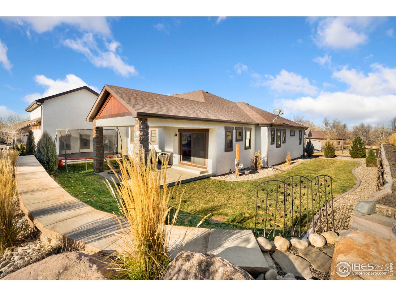 608 Riverside Court Greeley, CO 80634 - Photo 30 of 36 Nice front and backyard landscaping with stylish retaining walls