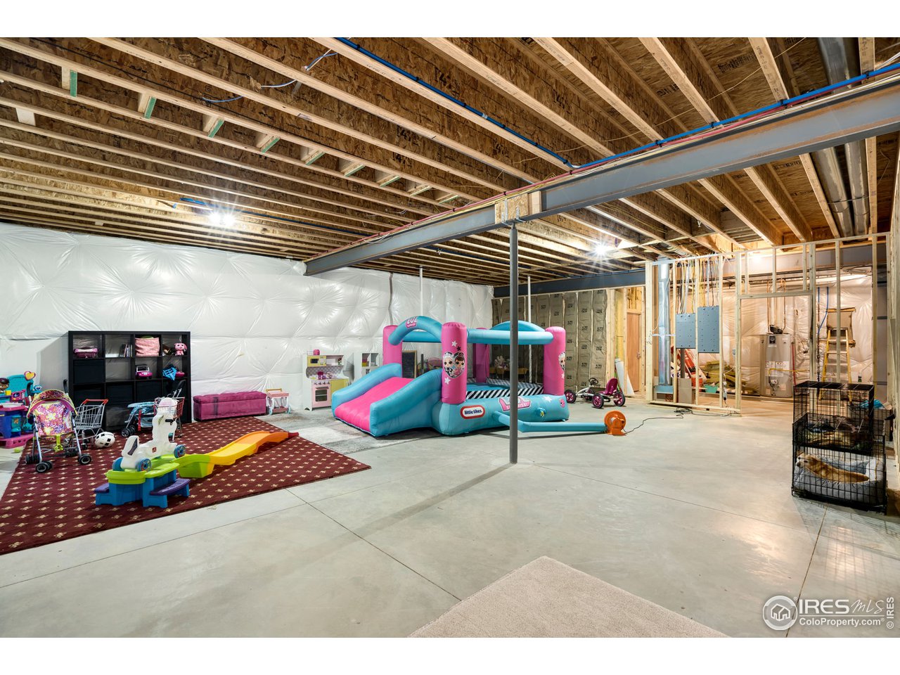 608 Riverside Court Greeley, CO 80634 - Photo 34 of 36 ~10ft high basement ceilings. Has 2 bathroom rough-ins and one for bar/kitchen option