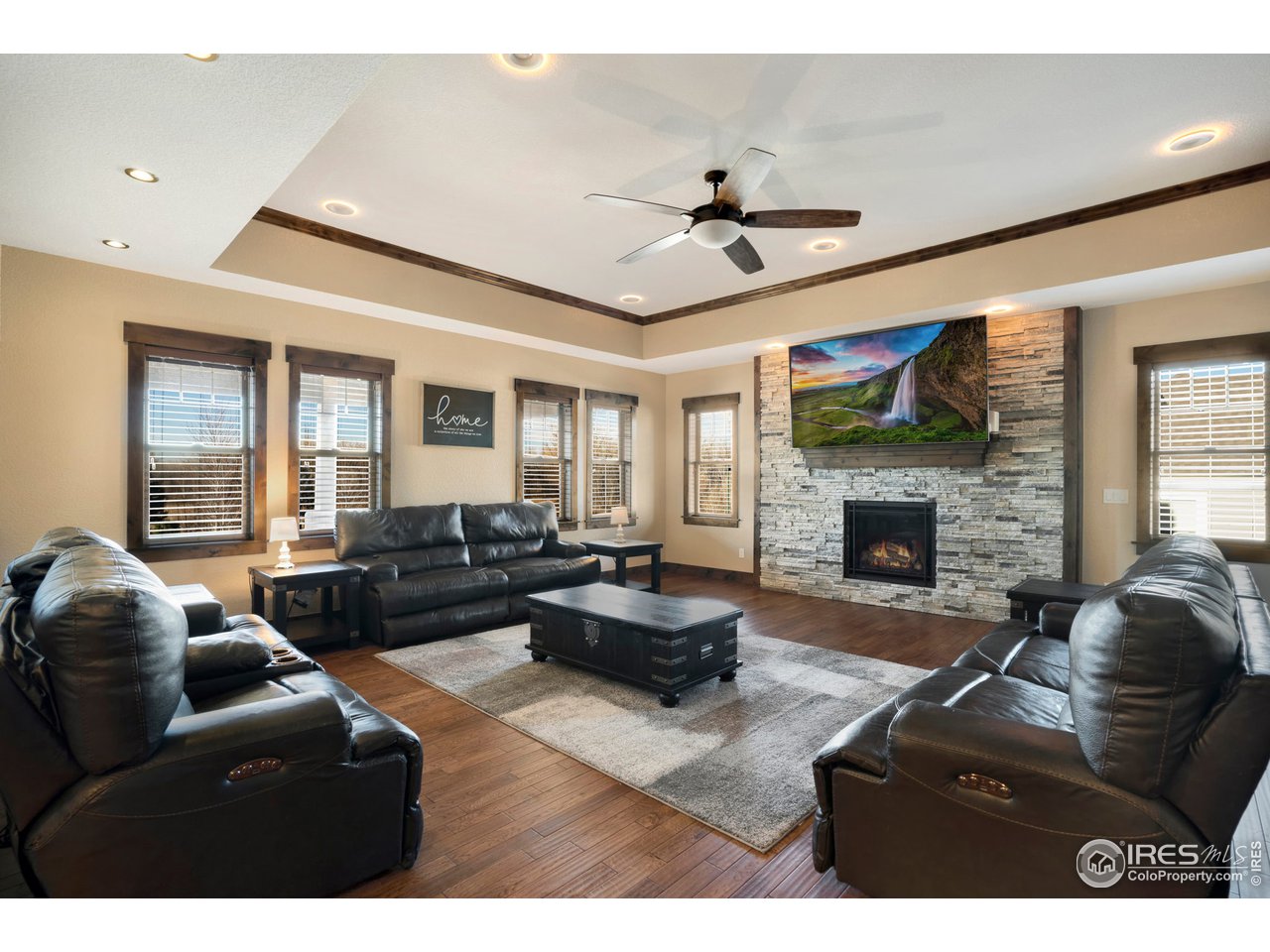 608 Riverside Court Greeley, CO 80634 - Photo 6 of 36 Fireplace and decorative wall