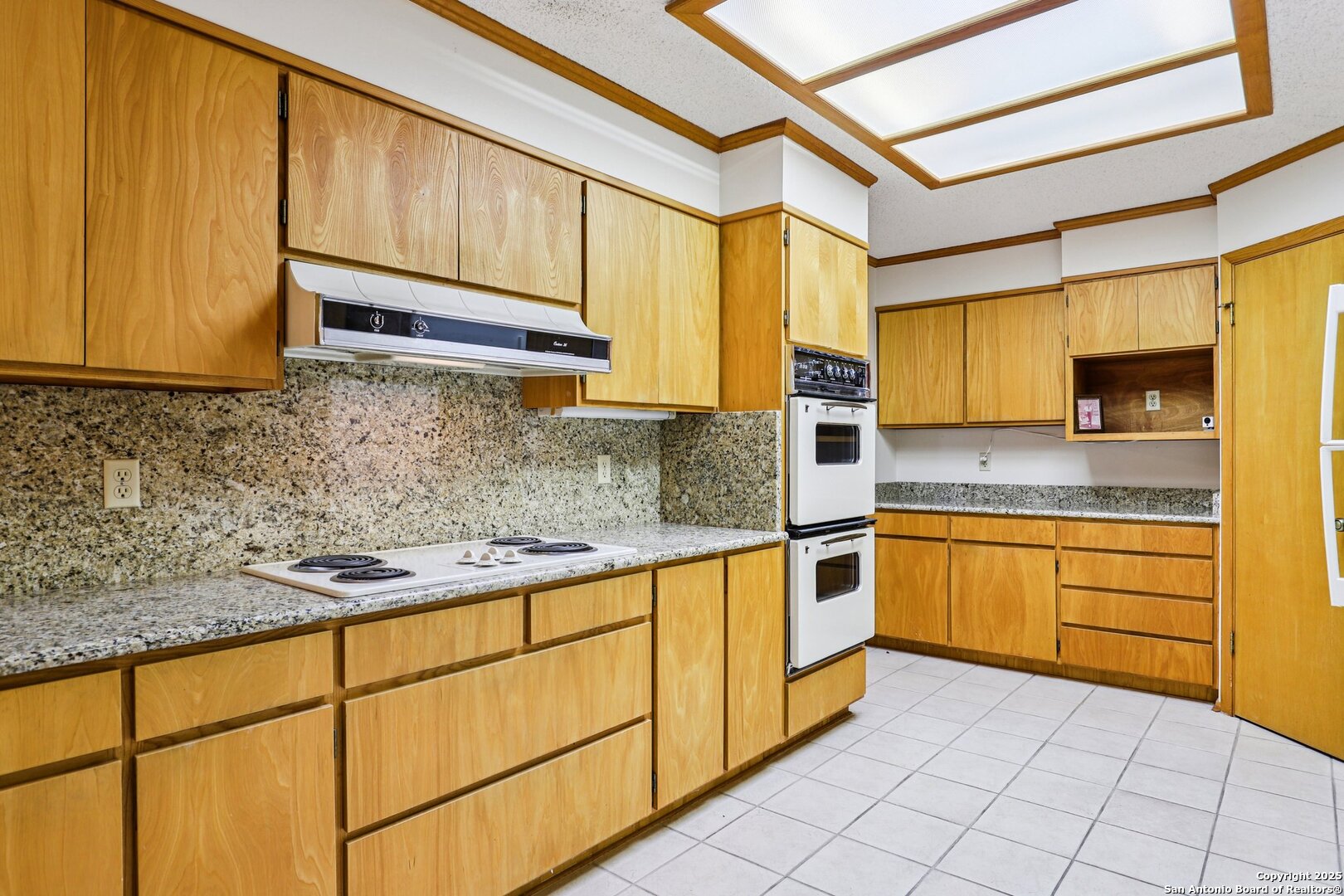 5817 Winding Ridge Drive Windcrest, TX 78239 - Photo 11 of 52 a kitchen with stainless steel appliances granite countertop a sink and cabinets