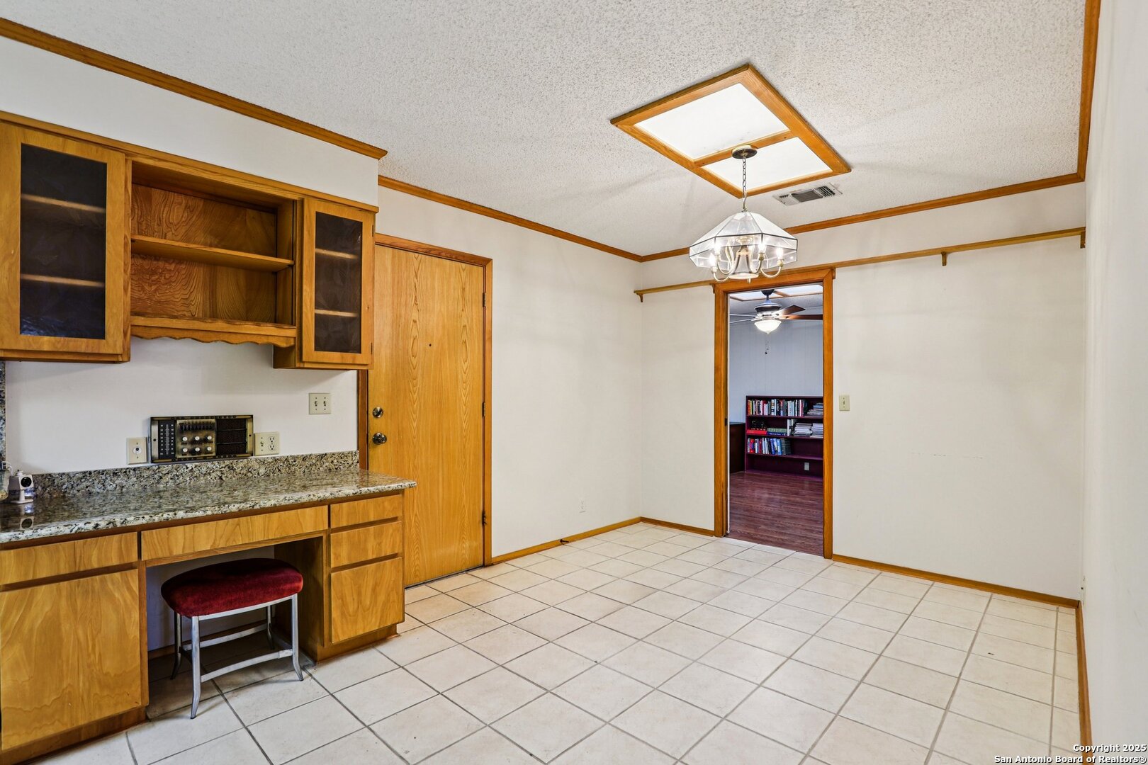 5817 Winding Ridge Drive Windcrest, TX 78239 - Photo 12 of 52 a kitchen with stainless steel appliances granite countertop a refrigerator and a sink