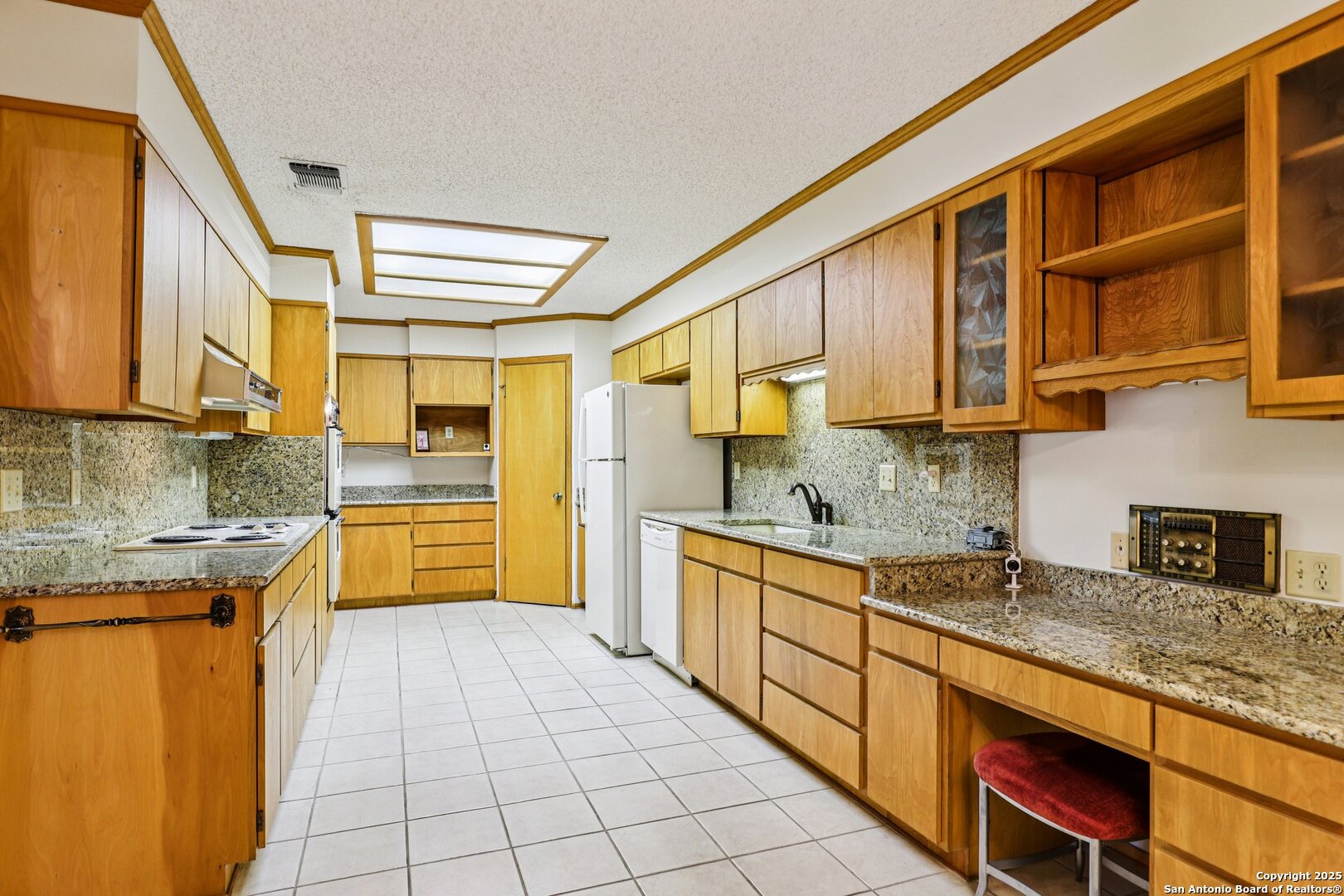 5817 Winding Ridge Drive Windcrest, TX 78239 - Photo 2 of 52 a kitchen with stainless steel appliances granite countertop a sink and cabinets