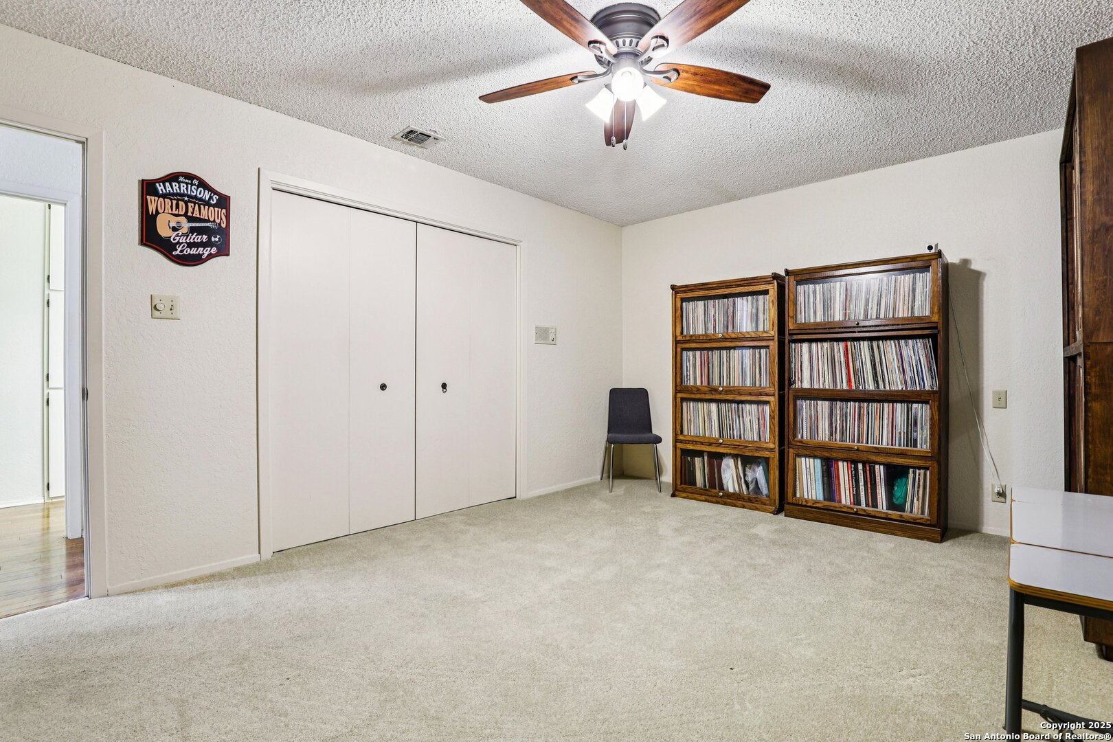 5817 Winding Ridge Drive Windcrest, TX 78239 - Photo 26 of 52 a view of an empty room with a bookshelf