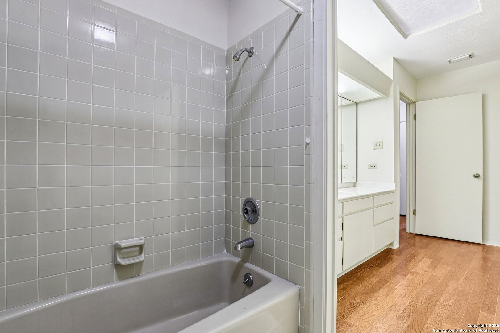 5817 Winding Ridge Drive Windcrest, TX 78239 - Photo 28 of 52 a bathroom with a bathtub and a shower