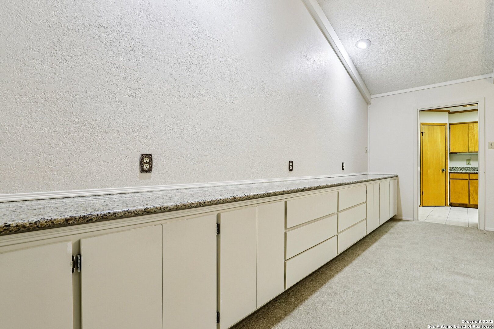 5817 Winding Ridge Drive Windcrest, TX 78239 - Photo 30 of 52 a bathroom with a granite countertop sink and a mirror