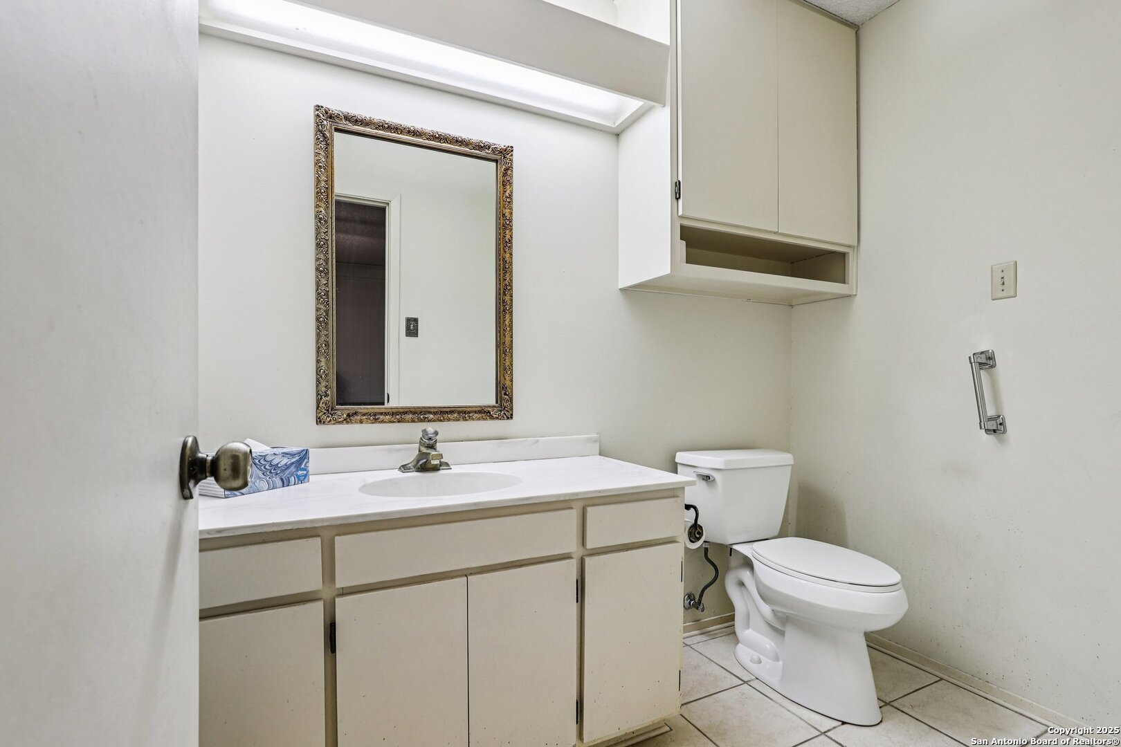 5817 Winding Ridge Drive Windcrest, TX 78239 - Photo 39 of 52 a bathroom with a toilet sink and mirror