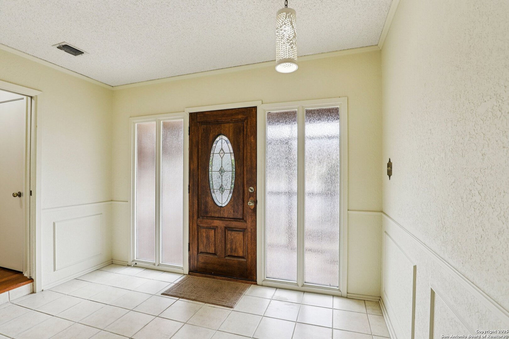 5817 Winding Ridge Drive Windcrest, TX 78239 - Photo 52 of 52 a view of a hallway with entryway wooden floor and front door