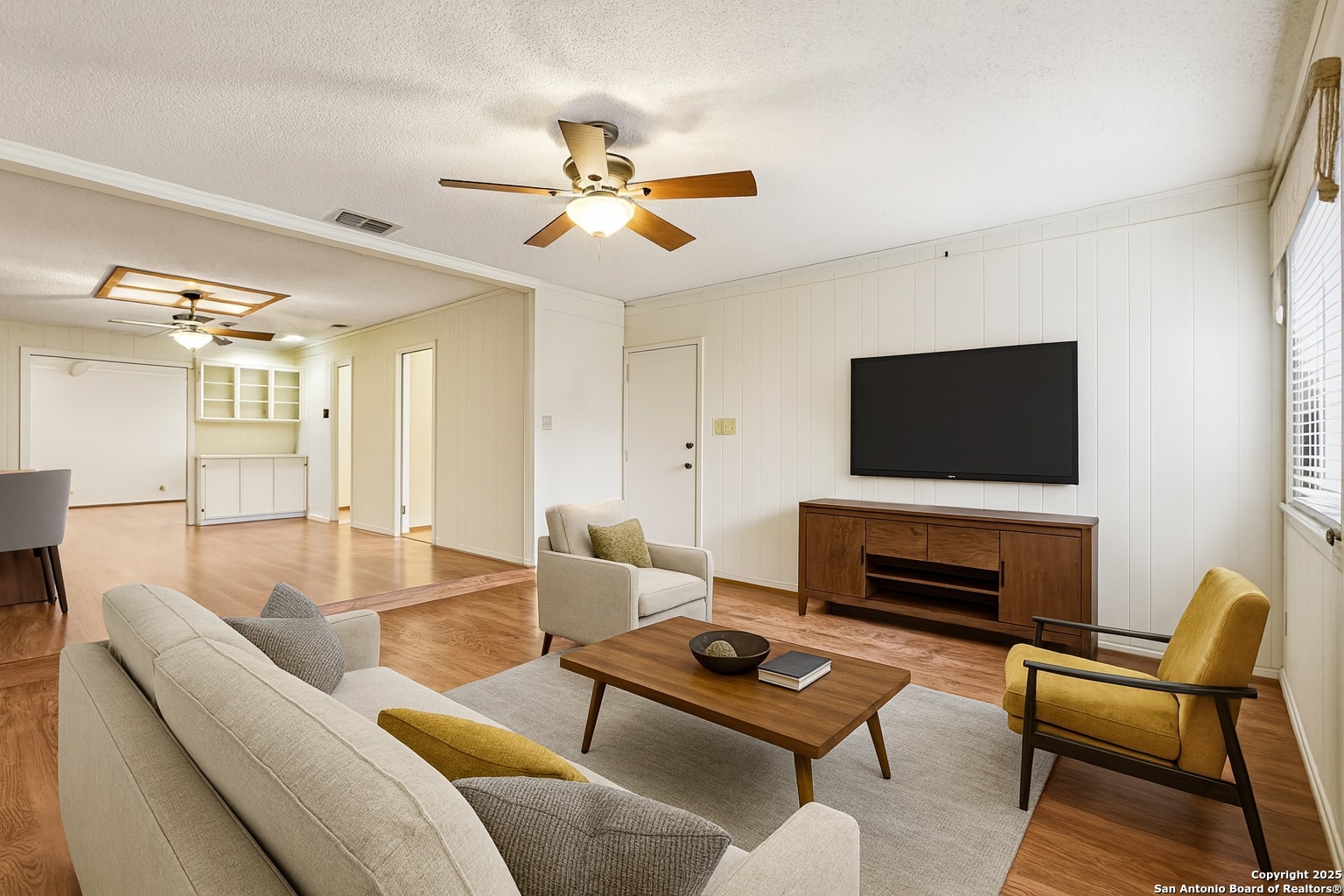 5817 Winding Ridge Drive Windcrest, TX 78239 - Photo 9 of 52 a living room with furniture a flat screen tv and a window