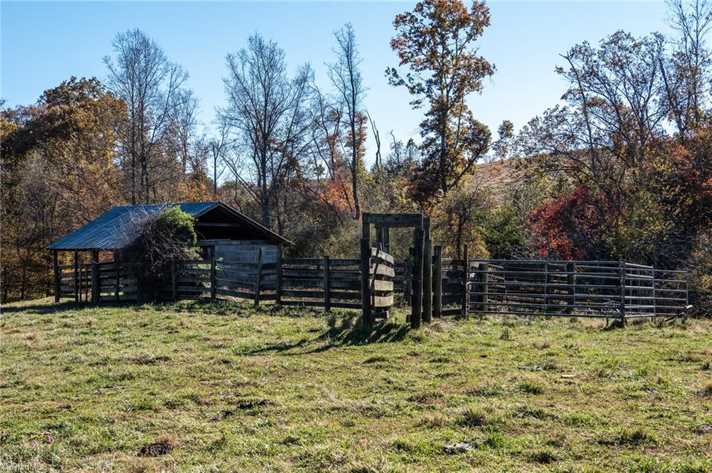 1180 Couchs Fish Lake Road State Road, NC 28676 - Photo 14 of 31 Barn and fencing on property.
