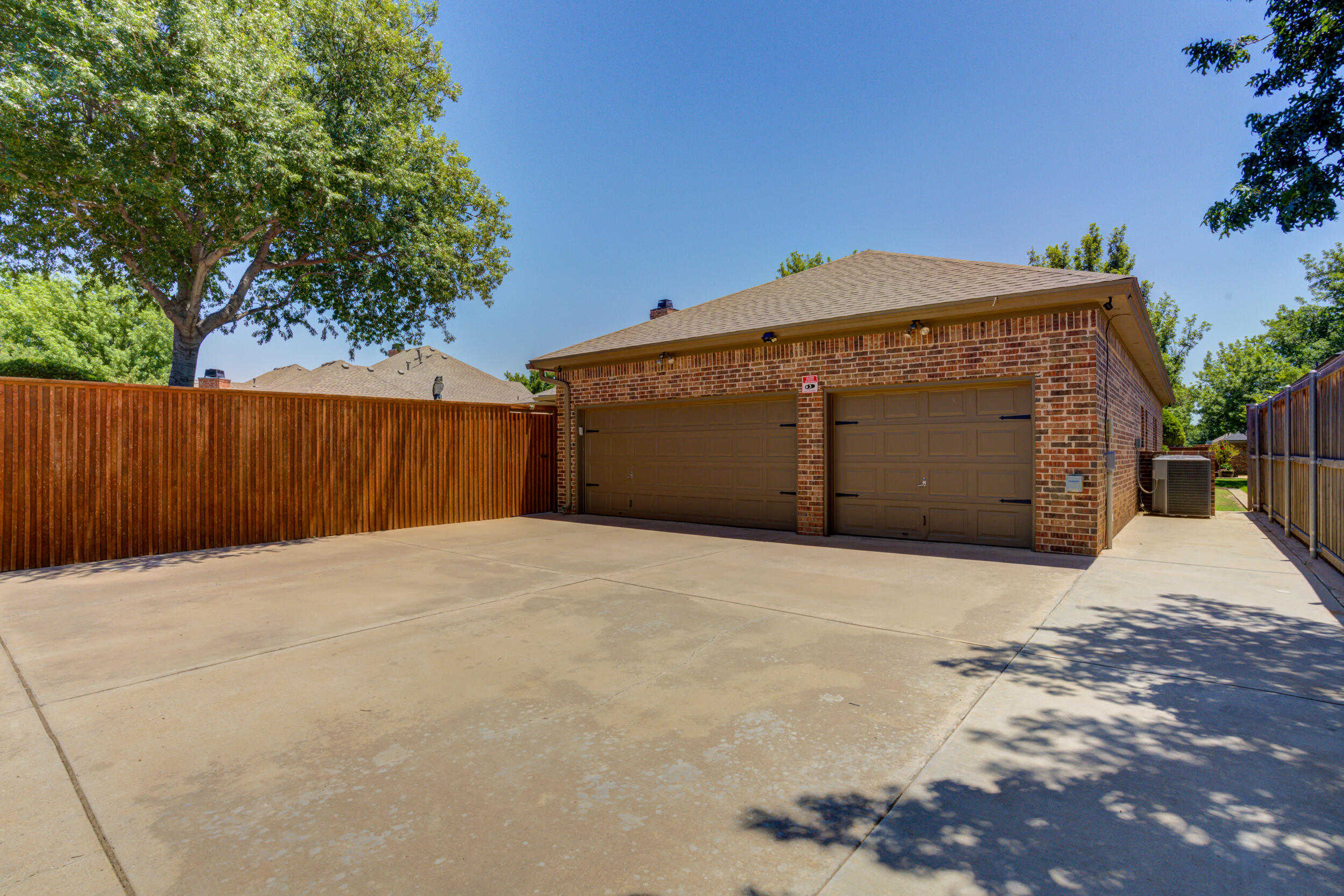 6008 89th Street Lubbock, TX 79424 - Photo 58 of 61 a front view of a house with a garage