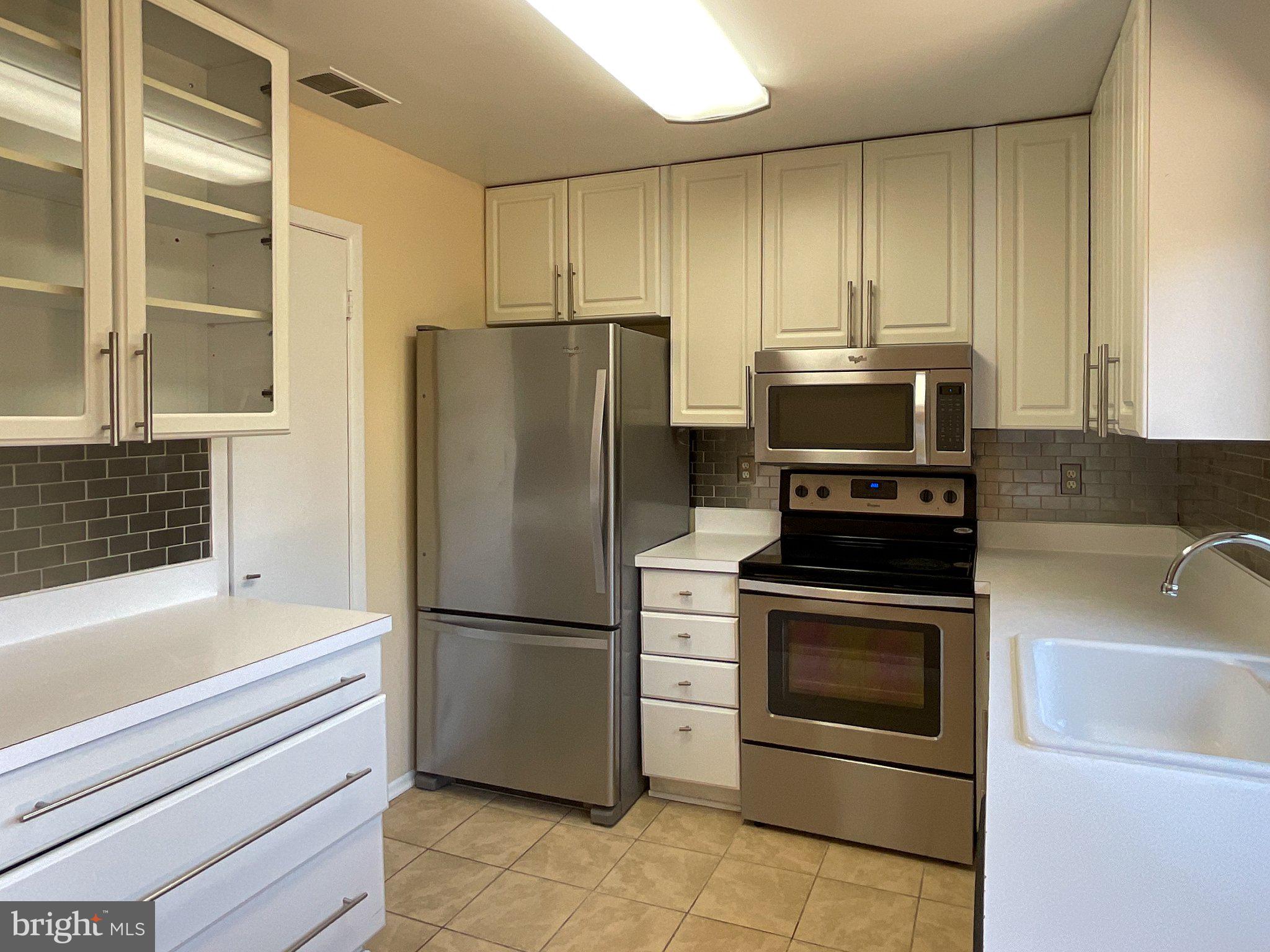 9040 Centerway Road Gaithersburg, MD 20879 - Photo 19 of 45 Modern kitchen with sleek finishes.