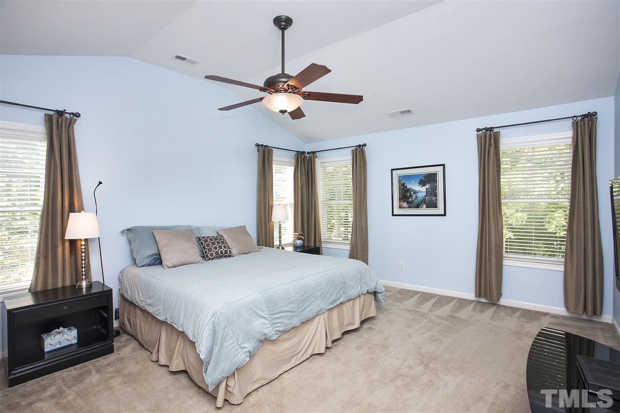 8621 Benzinger Drive Raleigh, NC 27613 - Photo 13 of 25 a bedroom with a large bed and a window