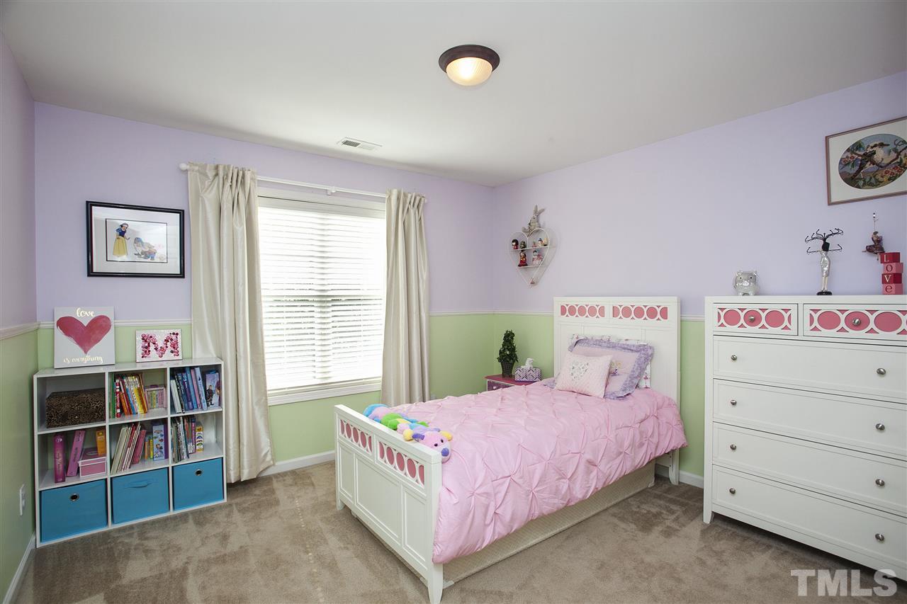 8621 Benzinger Drive Raleigh, NC 27613 - Photo 17 of 25 a bedroom with a bed and a closet
