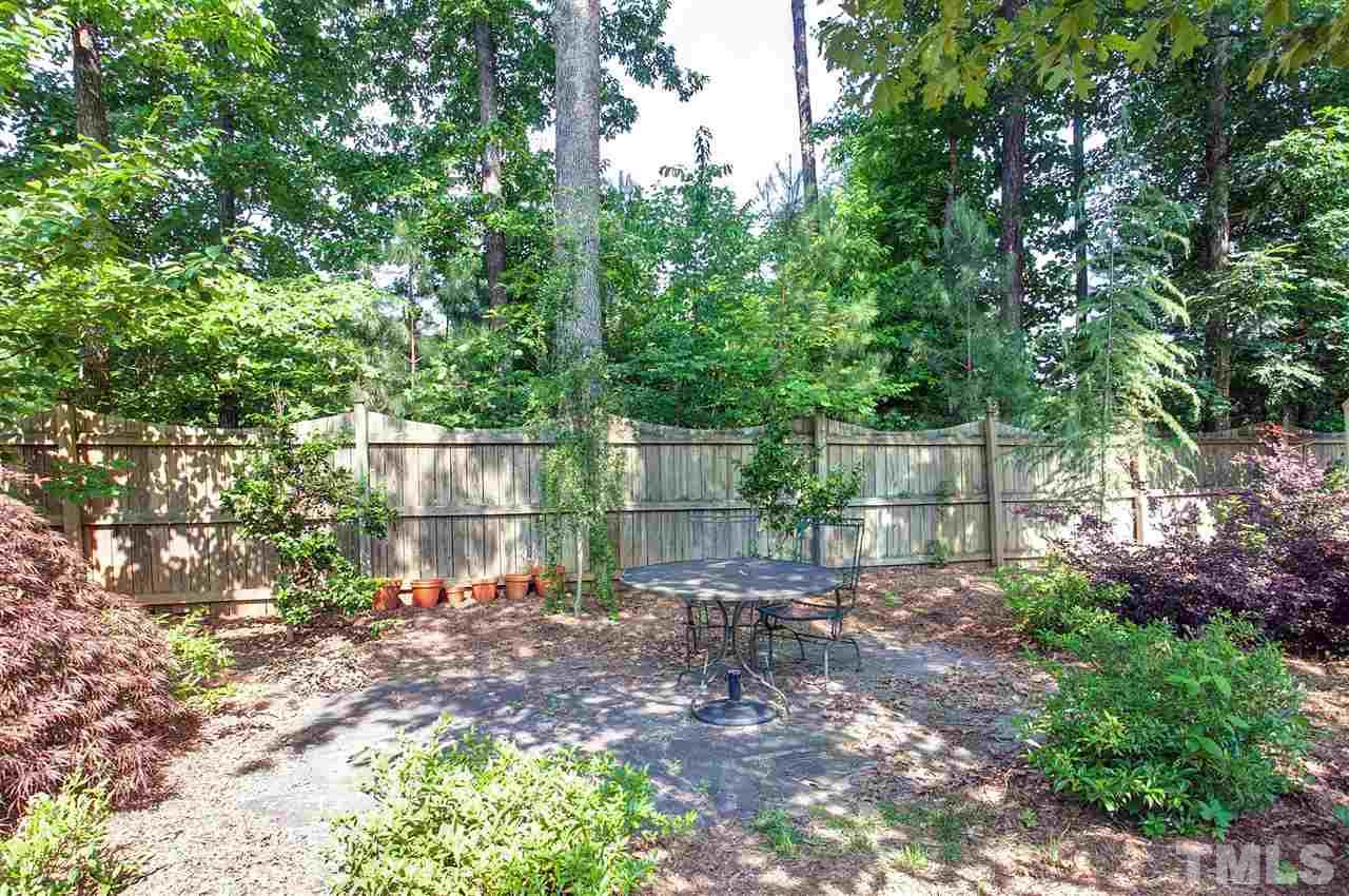 8621 Benzinger Drive Raleigh, NC 27613 - Photo 24 of 25 a backyard of a house with lots of green space