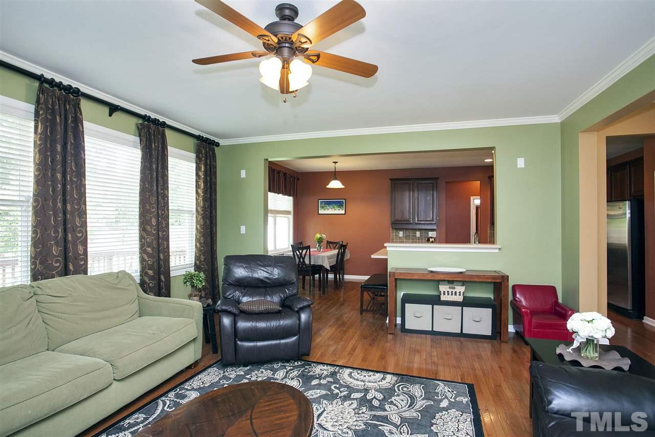 8621 Benzinger Drive Raleigh, NC 27613 - Photo 6 of 25 a living room with furniture and a large window